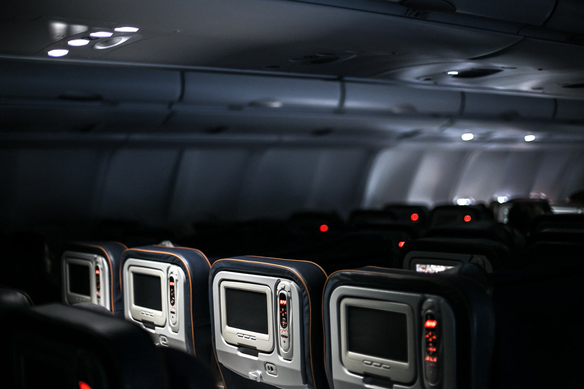how to sleep on a plane dark main cabin