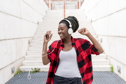 songs about adventure listening with headphones